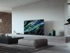 Minimalist living room with a large TV screen showcasing abstract artwork